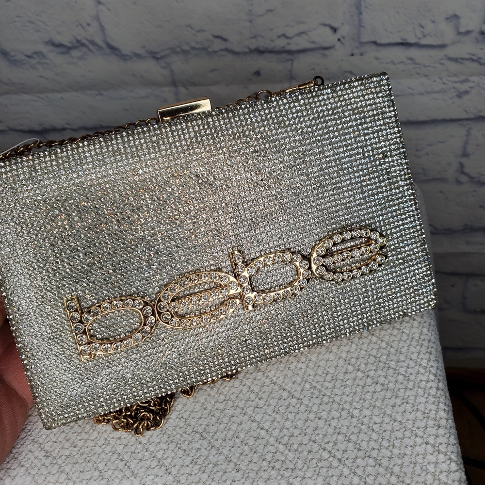 Bebe Sparkling Silver Clutch with Gold Accents